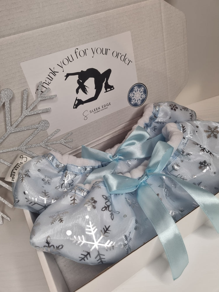 blue snowflake ice skate soakers with a silk bow