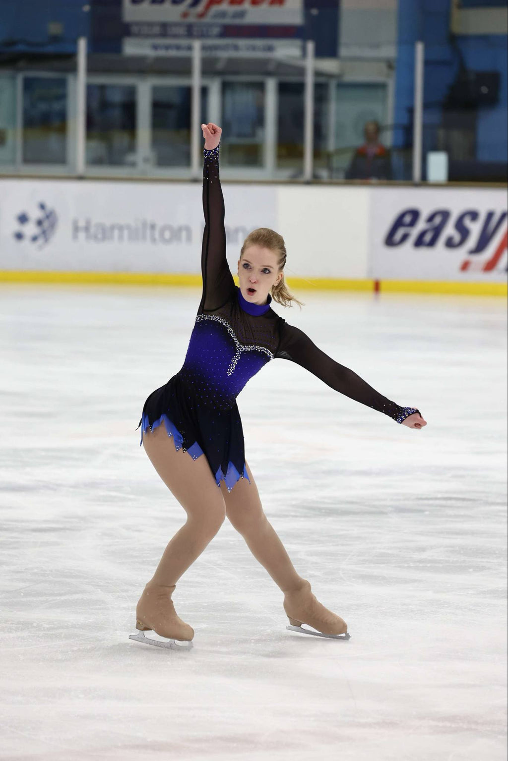 custom blue and black figure skating dress with rhinestones by Sleek Edge