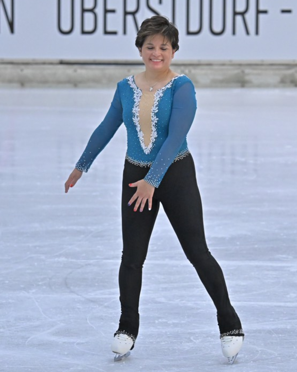custom teal and black figure skating catsuit with flowers by Sleek Edge