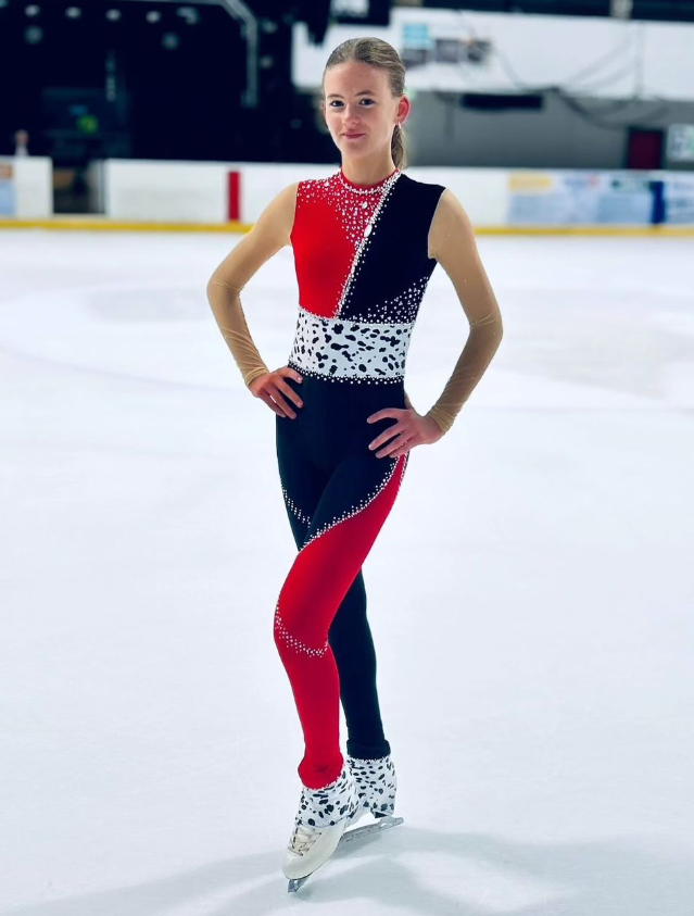 custom red and black figure skating catsuit with rhinestones by Sleek Edge. Cruella catsuit.