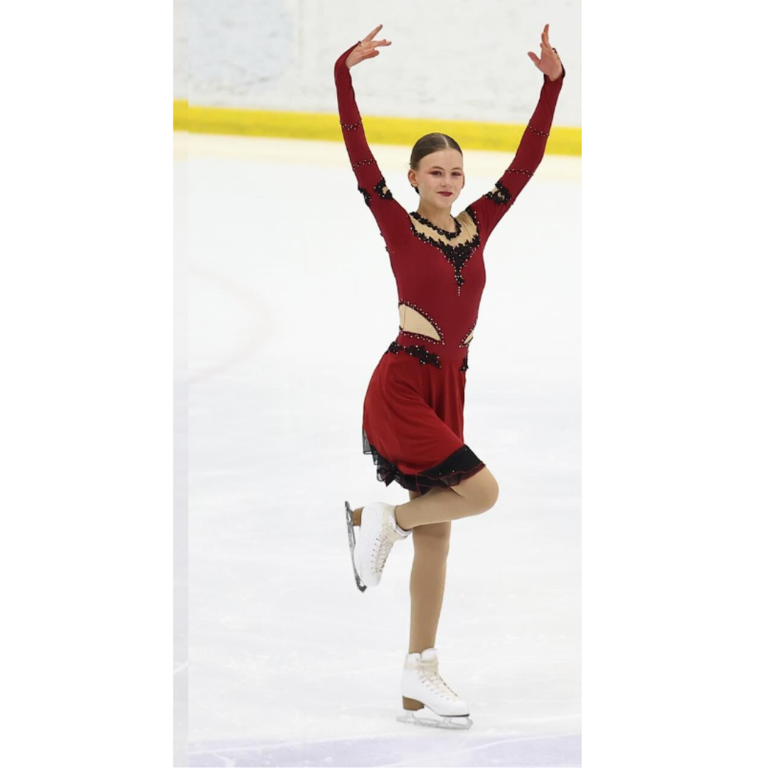 custom red and black salsa figure skating dress with appliques by Sleek Edge. 