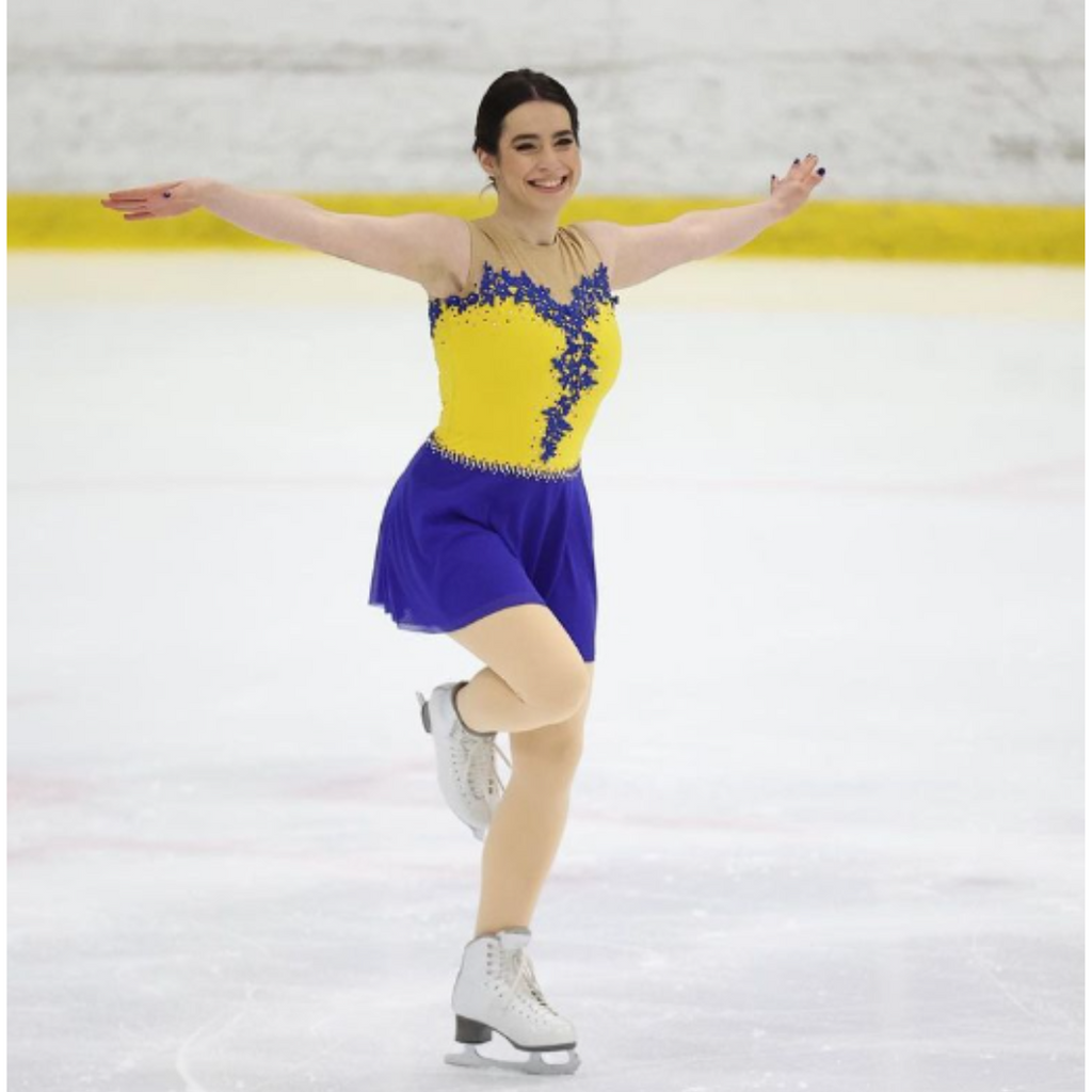 custom yellow and blue figure skating dress with appliques by Sleek Edge. Anastasia figure skating dress.