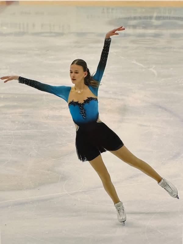 custom green and black figure skating dress with airbrushing by Sleek Edge